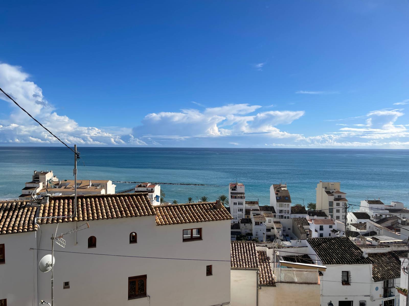 Coastal town and open sea, photographed by Dimitri Crasnojon
