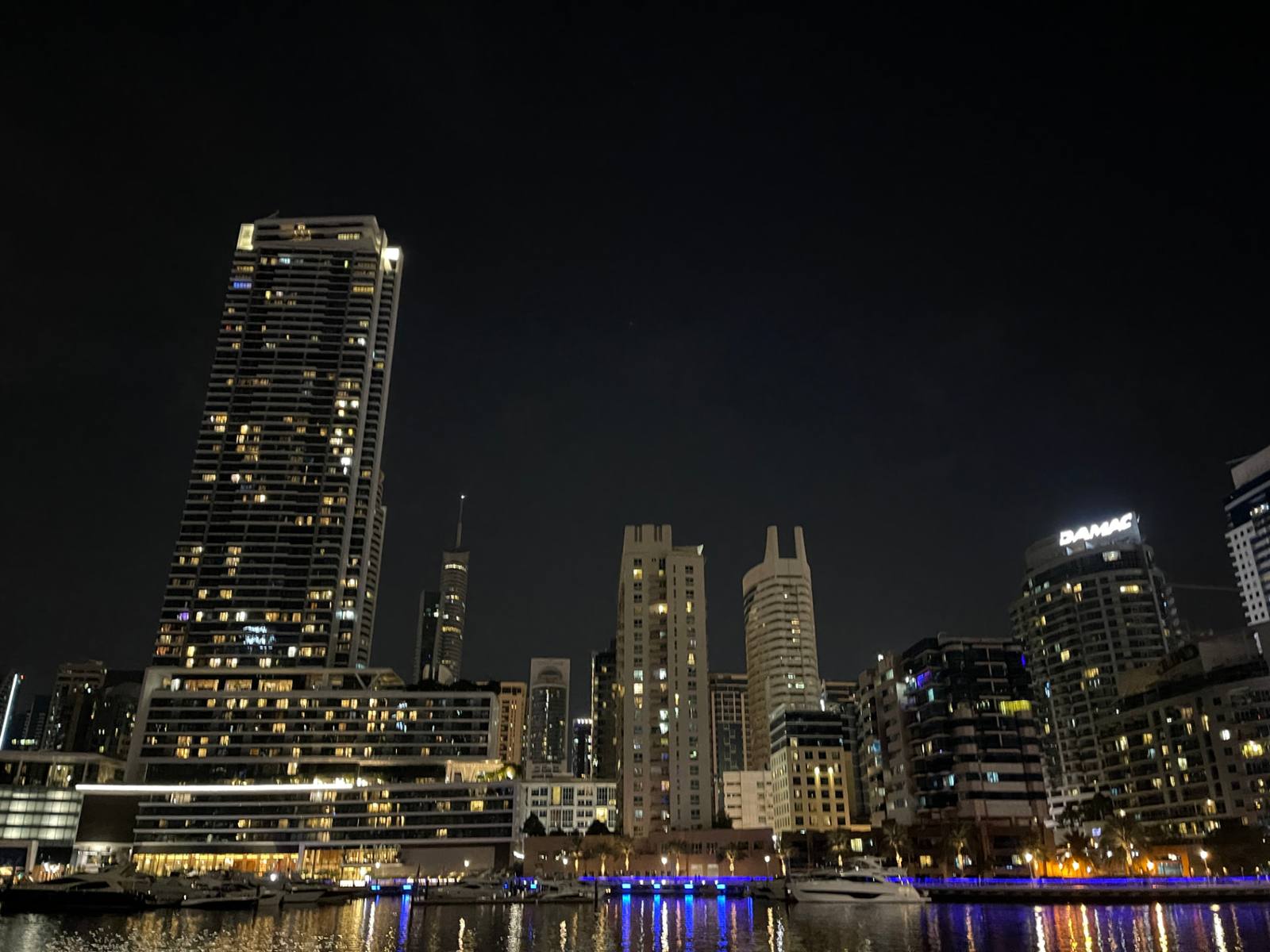 Waterfront skyline at night in Dubai